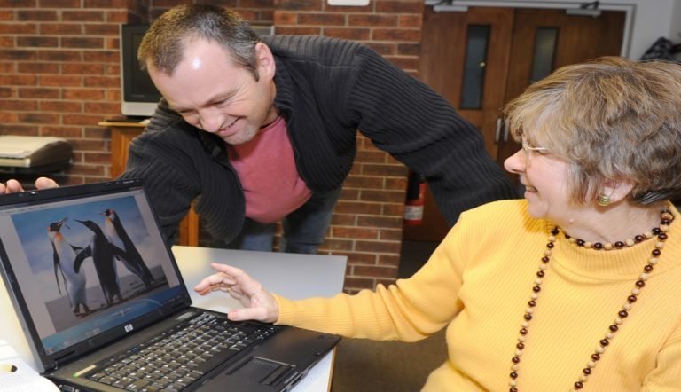 Man and woman looking at computer screen