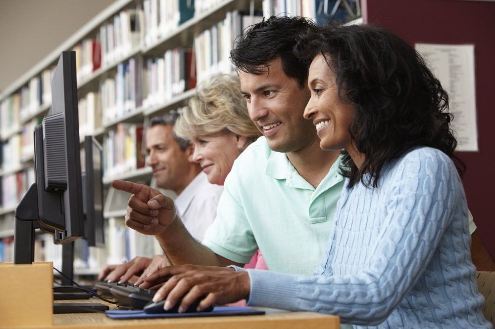 Students working on computers in library