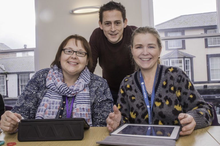 Digital Inclusion taining at the ASK Centre in Rhyl. Tutor Deian ap Rhisiart with Michelle Archer, Natasha Harper and Nikki Wilson.