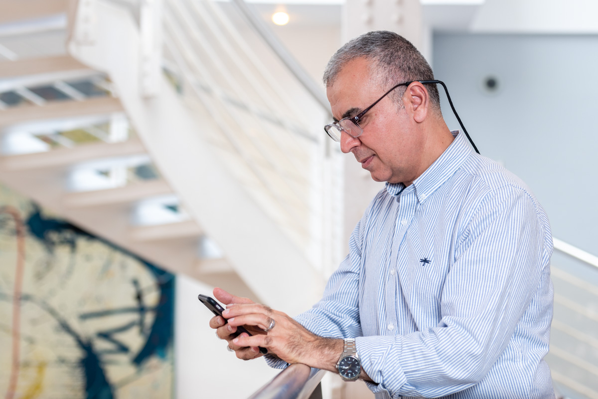 Older man looking at smartphone