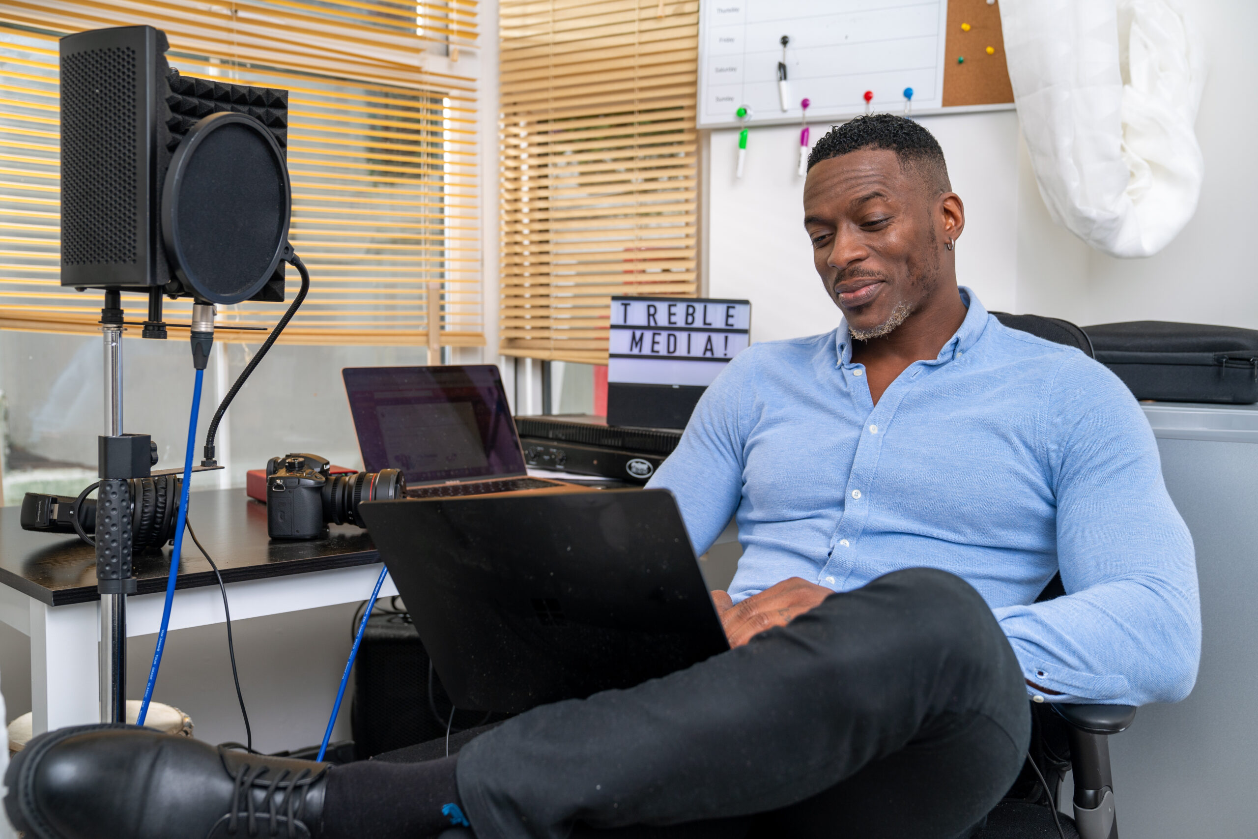 Young man using laptop in home office