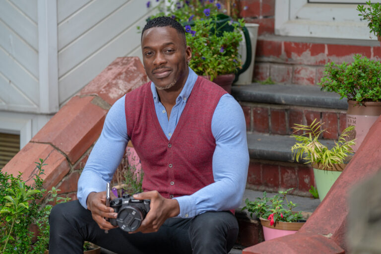 Young man with digital camera