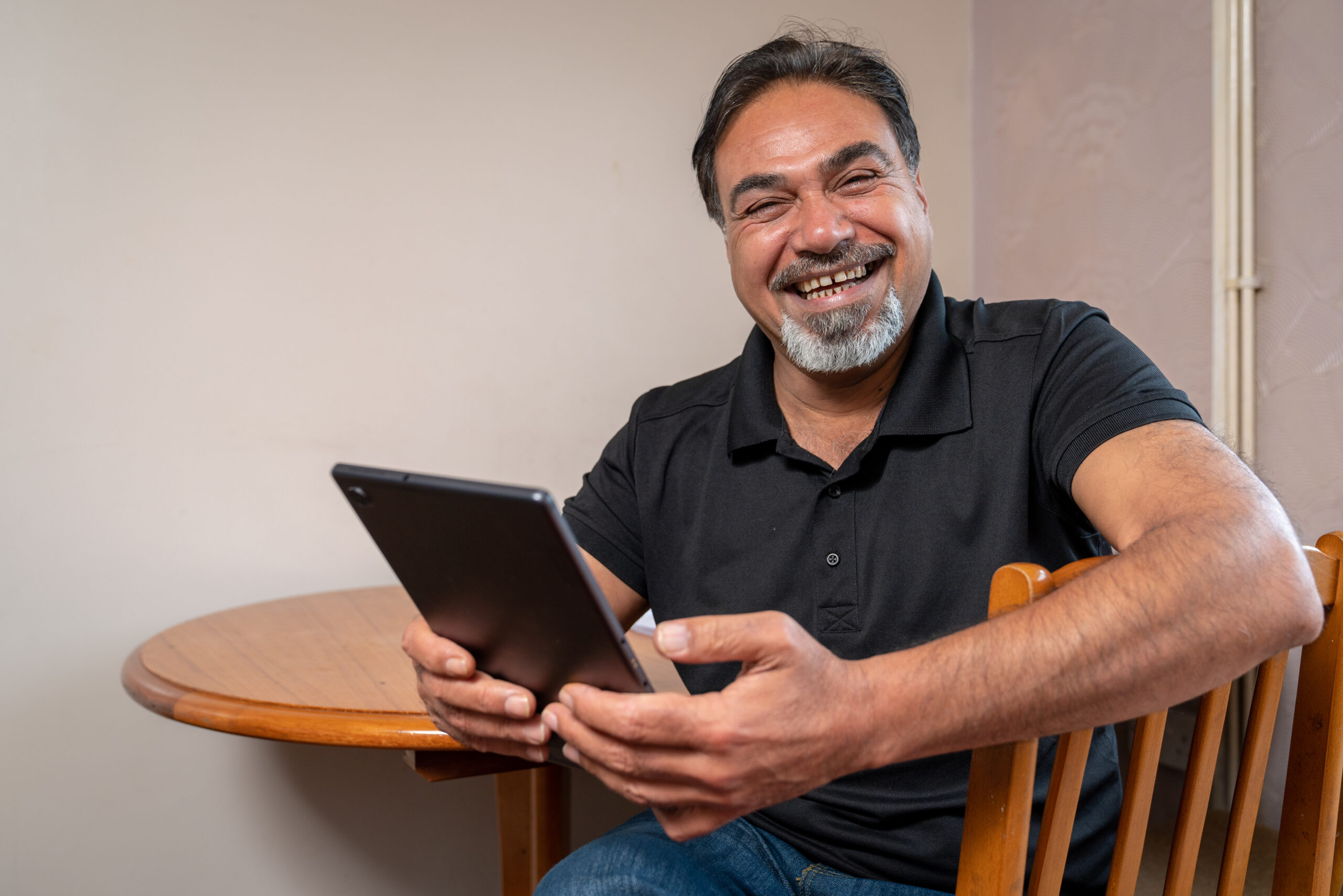 Older man with tablet device