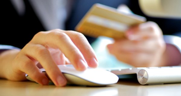 Person using credit card to buy something online