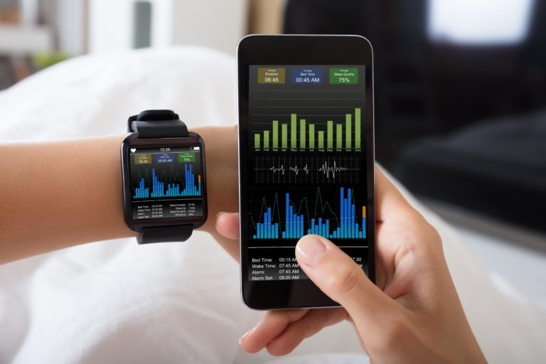 Close-up Of A Female's Hand With Smart Watch And Mobile