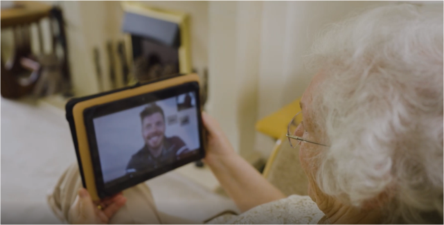 senior lady making video call on tablet device